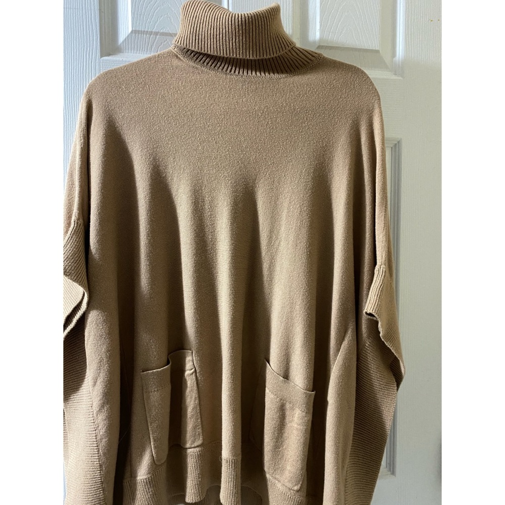 Michael Kors turtleneck sleeveless sweater.